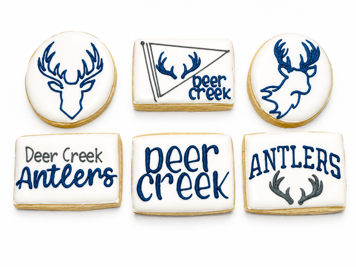 Six Deer Creek Midi cookies with antlers, deer silhouettes, pennant, and Deer Creek lettering